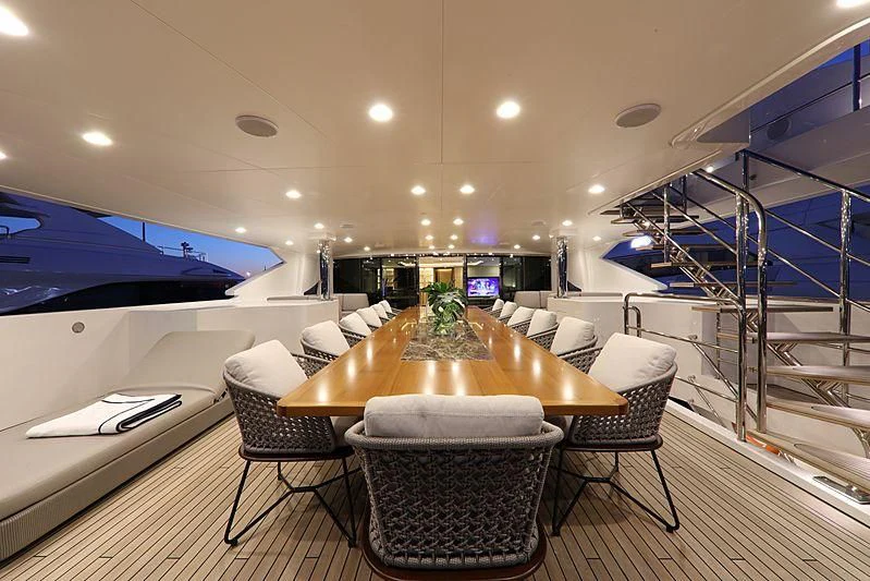 a room with a table chairs and a tv aboard MONT-AL LAWZ Yacht for Sale
