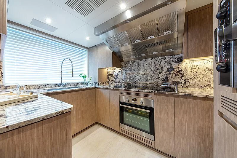 a kitchen with a marble counter top aboard MONT-AL LAWZ Yacht for Sale