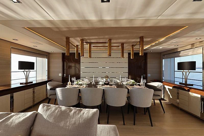 a room with a table chairs and a tv aboard MONT-AL LAWZ Yacht for Sale