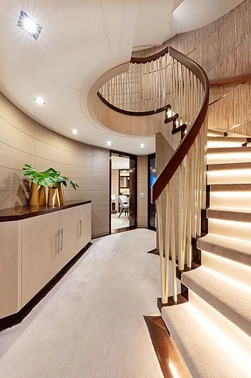 a hallway with a chandelier and a staircase aboard MONT-AL LAWZ Yacht for Sale