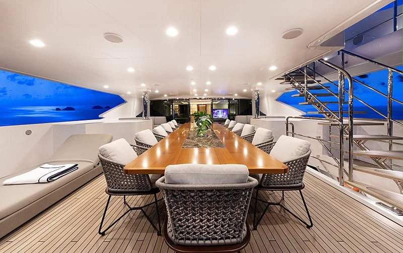 a room with a table chairs and a couch aboard MONT-AL LAWZ Yacht for Sale