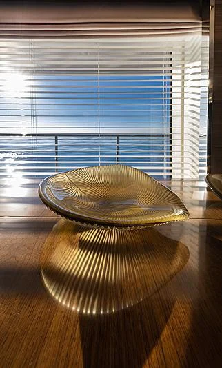 a gold bowl on a wooden surface aboard MONT-AL LAWZ Yacht for Sale