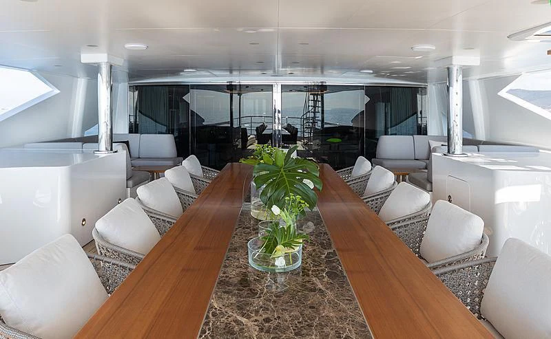 a large room with a large table and chairs aboard MONT-AL LAWZ Yacht for Sale