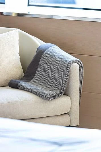 a pillow on a couch aboard MONT-AL LAWZ Yacht for Sale