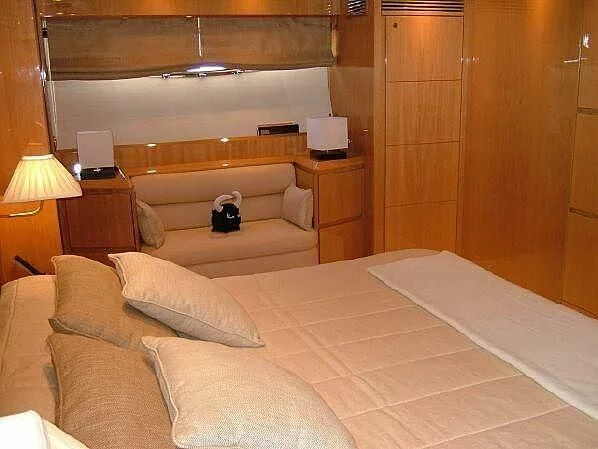 a room with a bed and a couch aboard TIFFANY Yacht for Sale