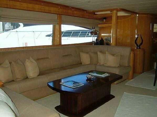 a living room with a couch and a table aboard TIFFANY Yacht for Sale