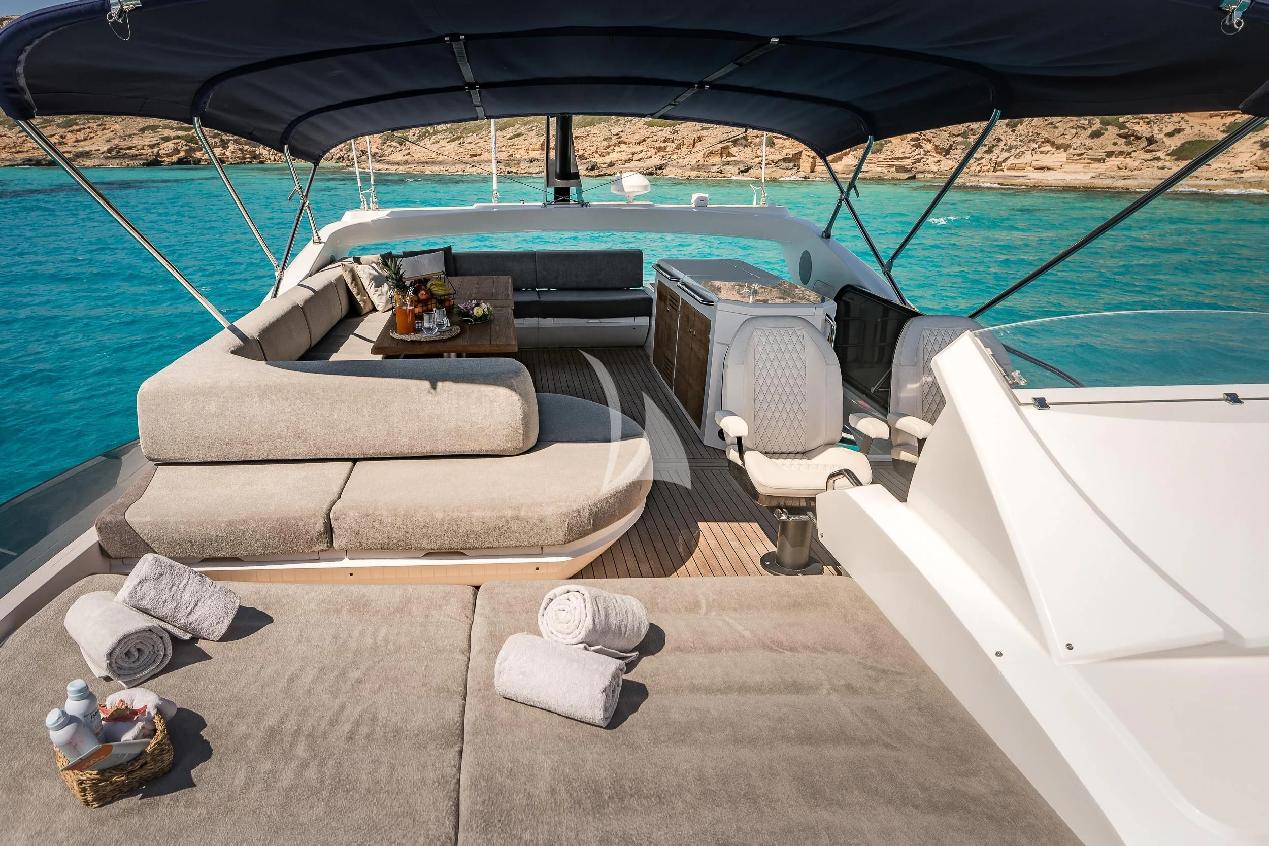 a deck with a pool and lounge chairs on it aboard SEAWATER Yacht for Sale