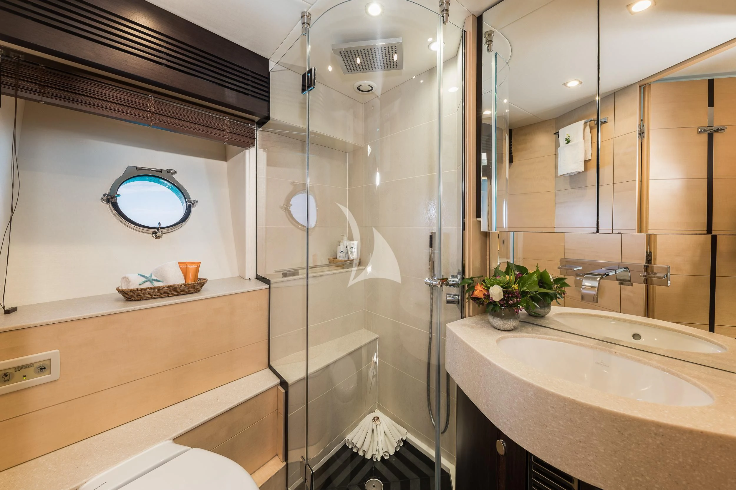 a bathroom with a glass shower aboard SEAWATER Yacht for Sale