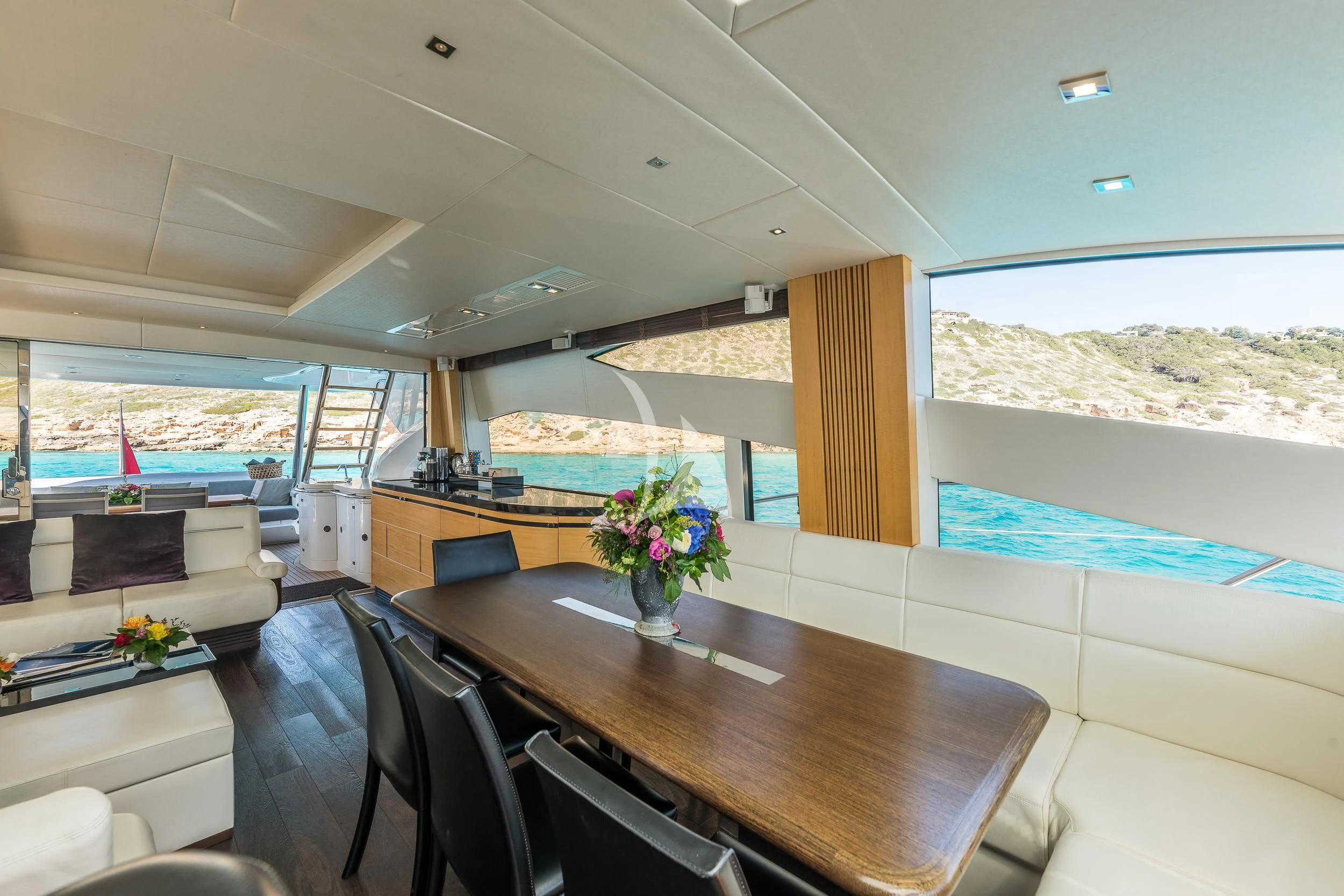 a room with a table and chairs aboard SEAWATER Yacht for Sale