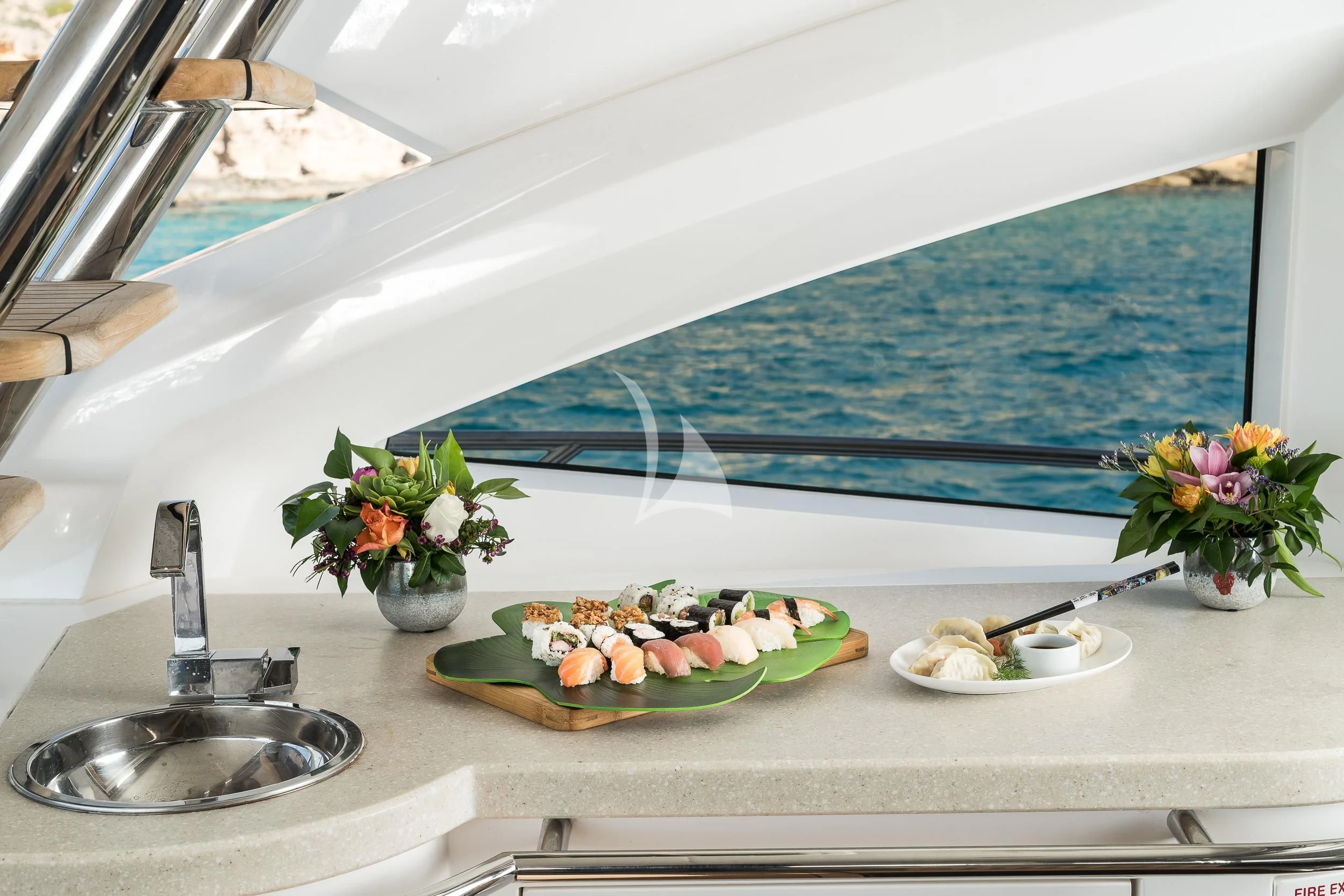 a sink with a bowl of fruit next to it aboard SEAWATER Yacht for Sale