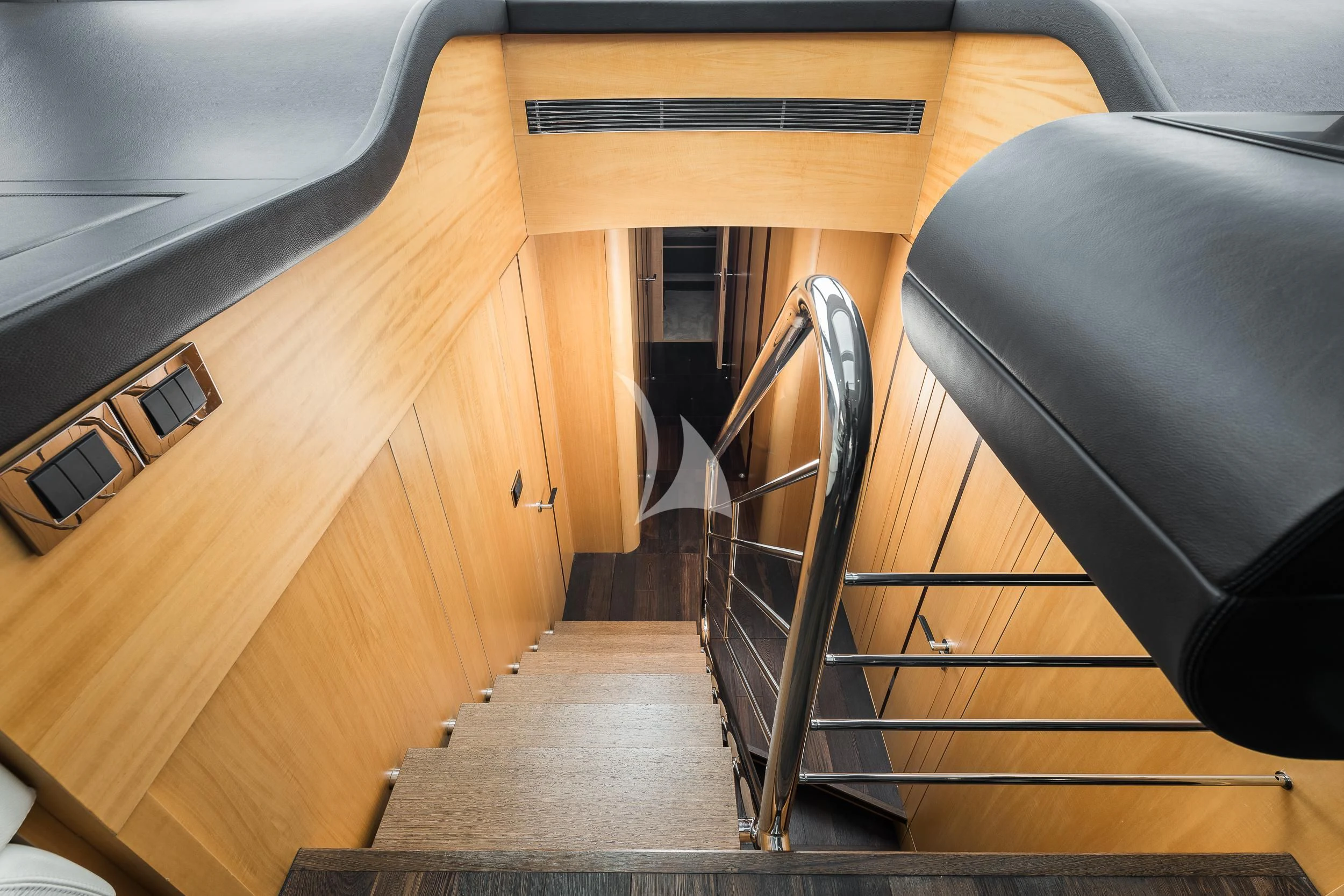 a wooden table with a chair aboard SEAWATER Yacht for Sale