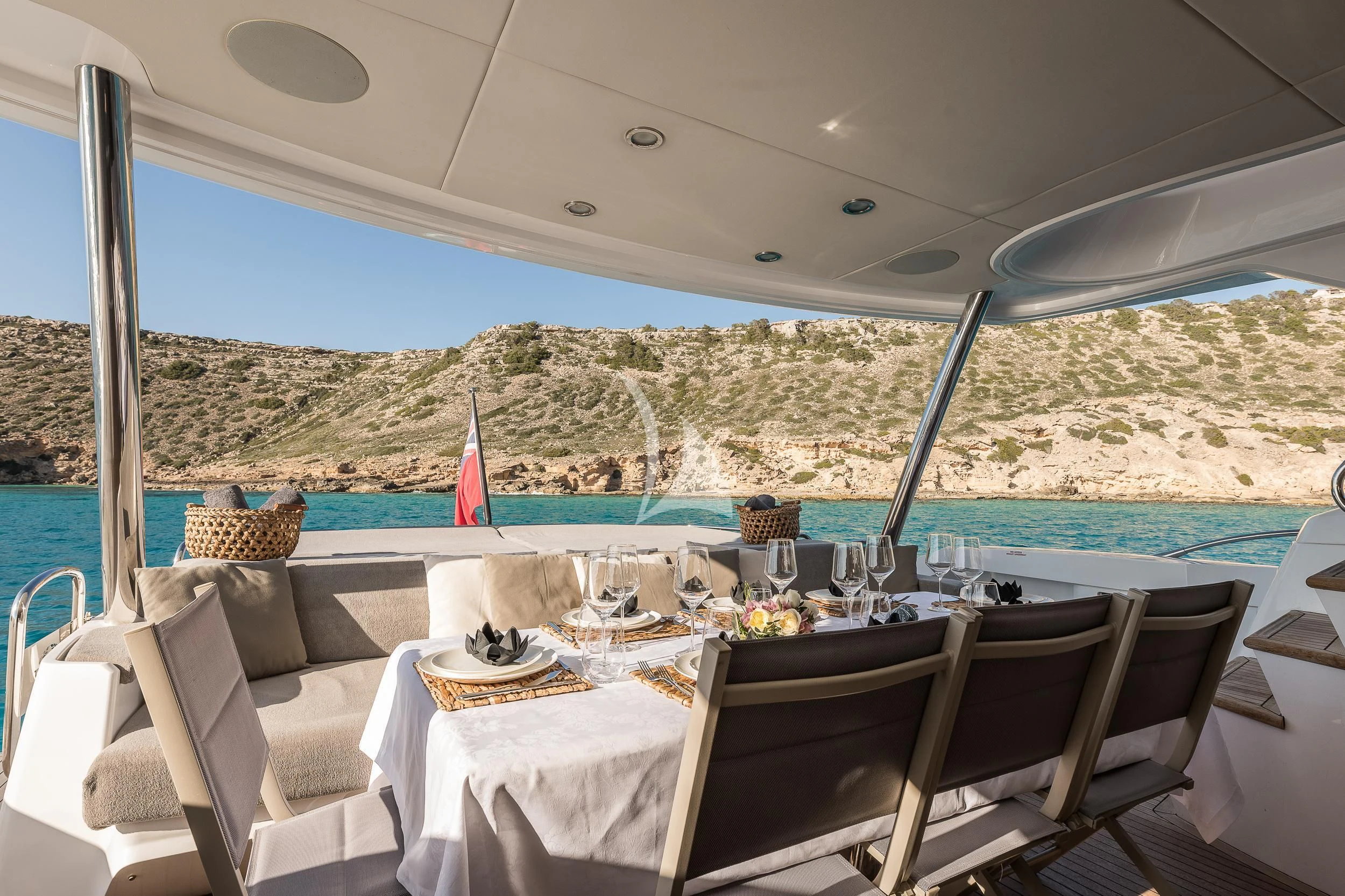 a table set for a dinner on a boat aboard SEAWATER Yacht for Sale
