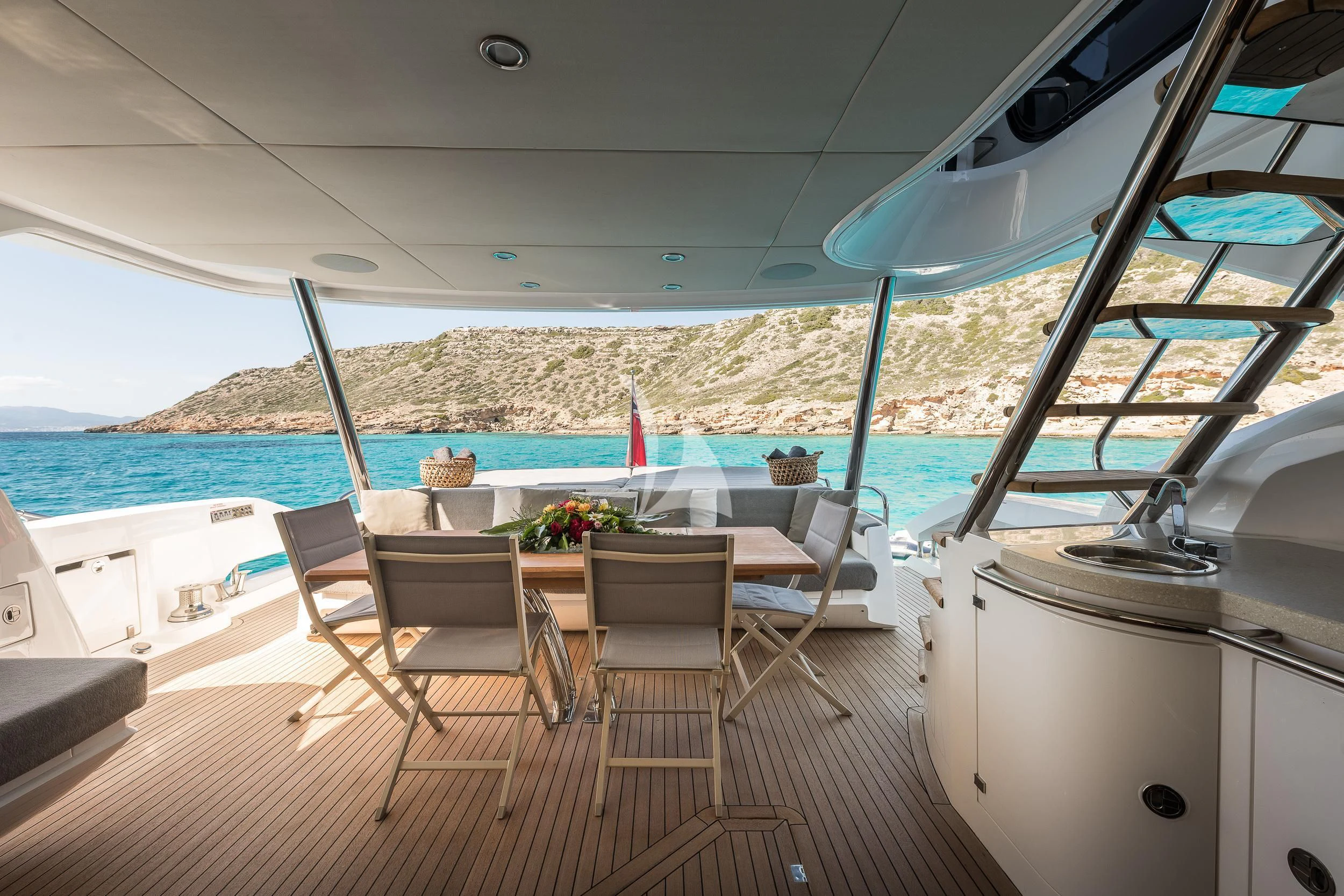 a boat with a table and chairs aboard SEAWATER Yacht for Sale