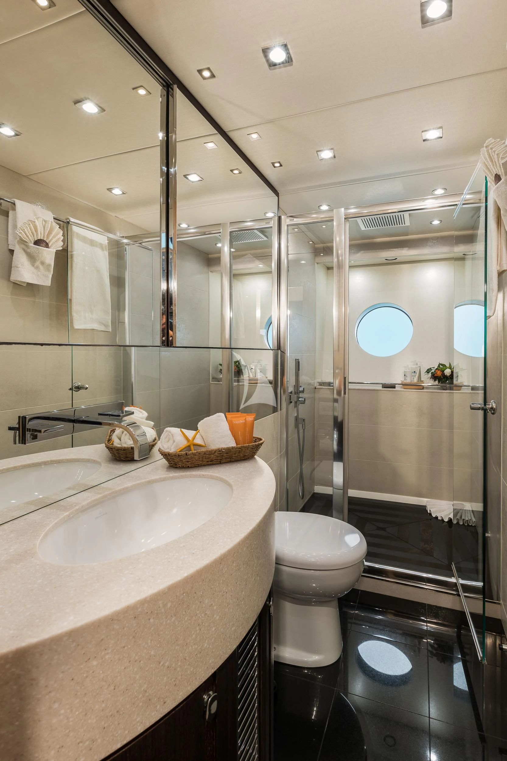 a bathroom with a glass shower aboard SEAWATER Yacht for Sale