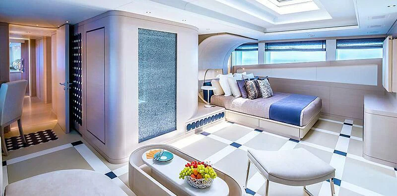 a room with a bed and a table aboard QUEEN ALLA Yacht for Sale