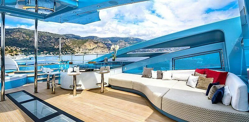 a room with a bed and a large window overlooking a large body of water aboard QUEEN ALLA Yacht for Sale