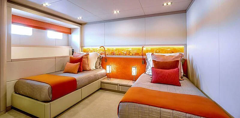 a room with beds and a couch aboard QUEEN ALLA Yacht for Sale
