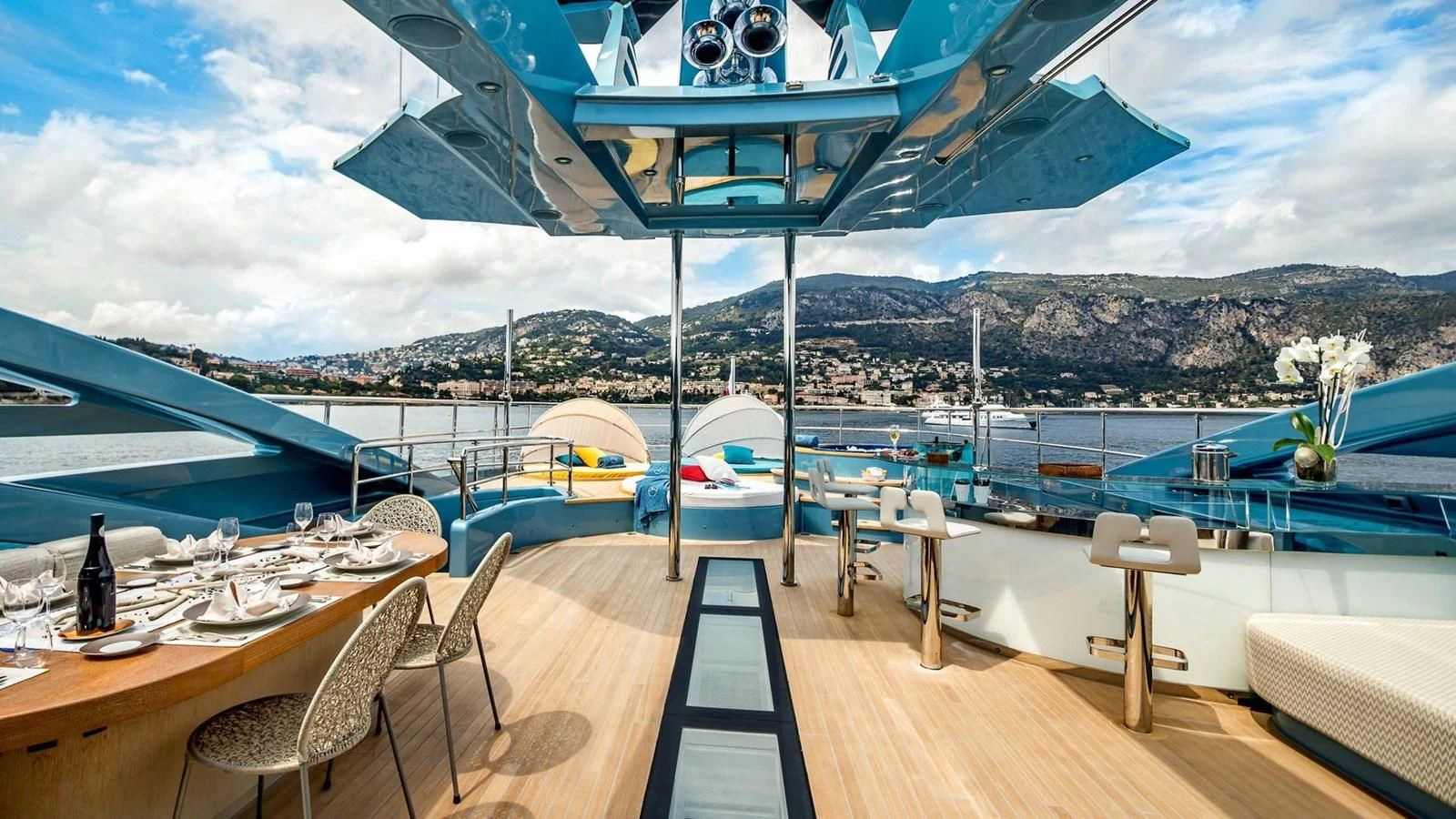 a deck with a view of a city and water aboard QUEEN ALLA Yacht for Sale