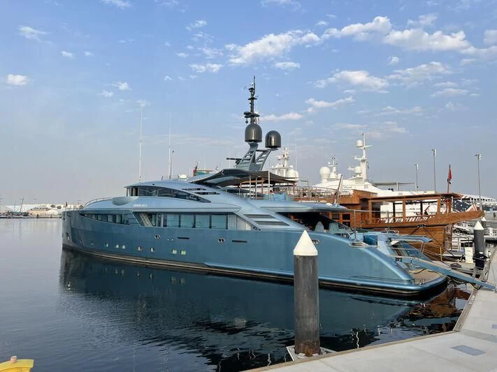 a large blue boat docked aboard QUEEN ALLA Yacht for Sale