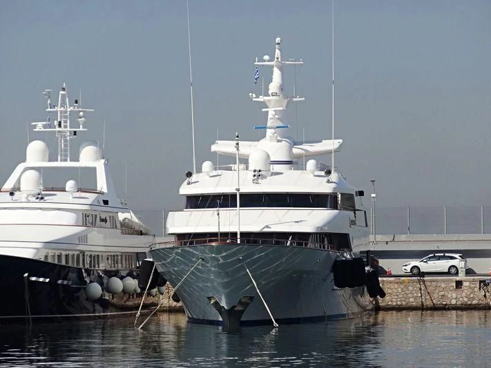 a couple of large boats are parked in the water aboard PARIS Yacht for Sale