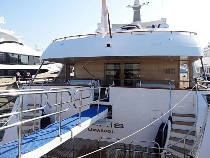 a large white boat with a deck aboard PARIS Yacht for Sale
