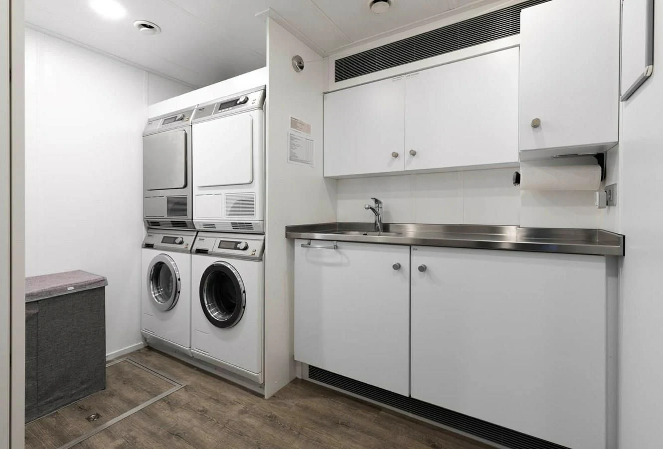 a washer and dryer in a kitchen aboard CHASING ROMANCE Yacht for Sale
