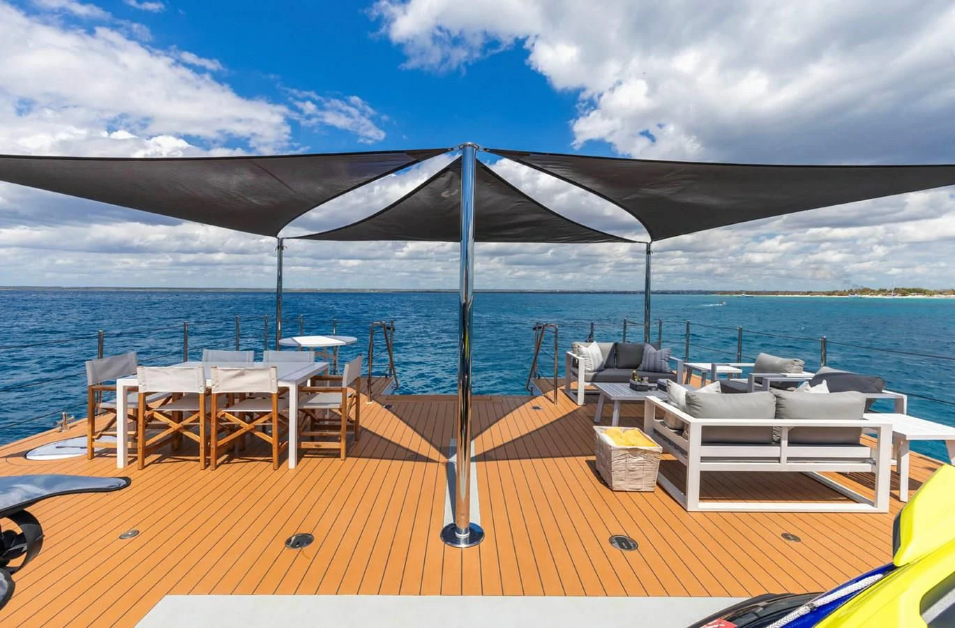 a deck with chairs and umbrellas on it aboard CHASING ROMANCE Yacht for Sale