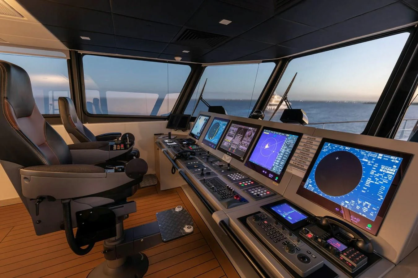 a control room with many monitors aboard CHASING ROMANCE Yacht for Sale