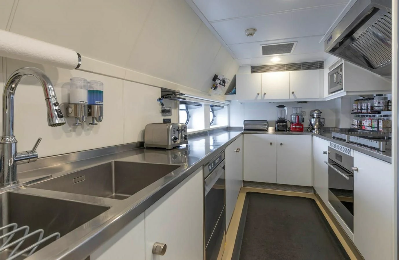 a kitchen with stainless steel appliances aboard CHASING ROMANCE Yacht for Sale