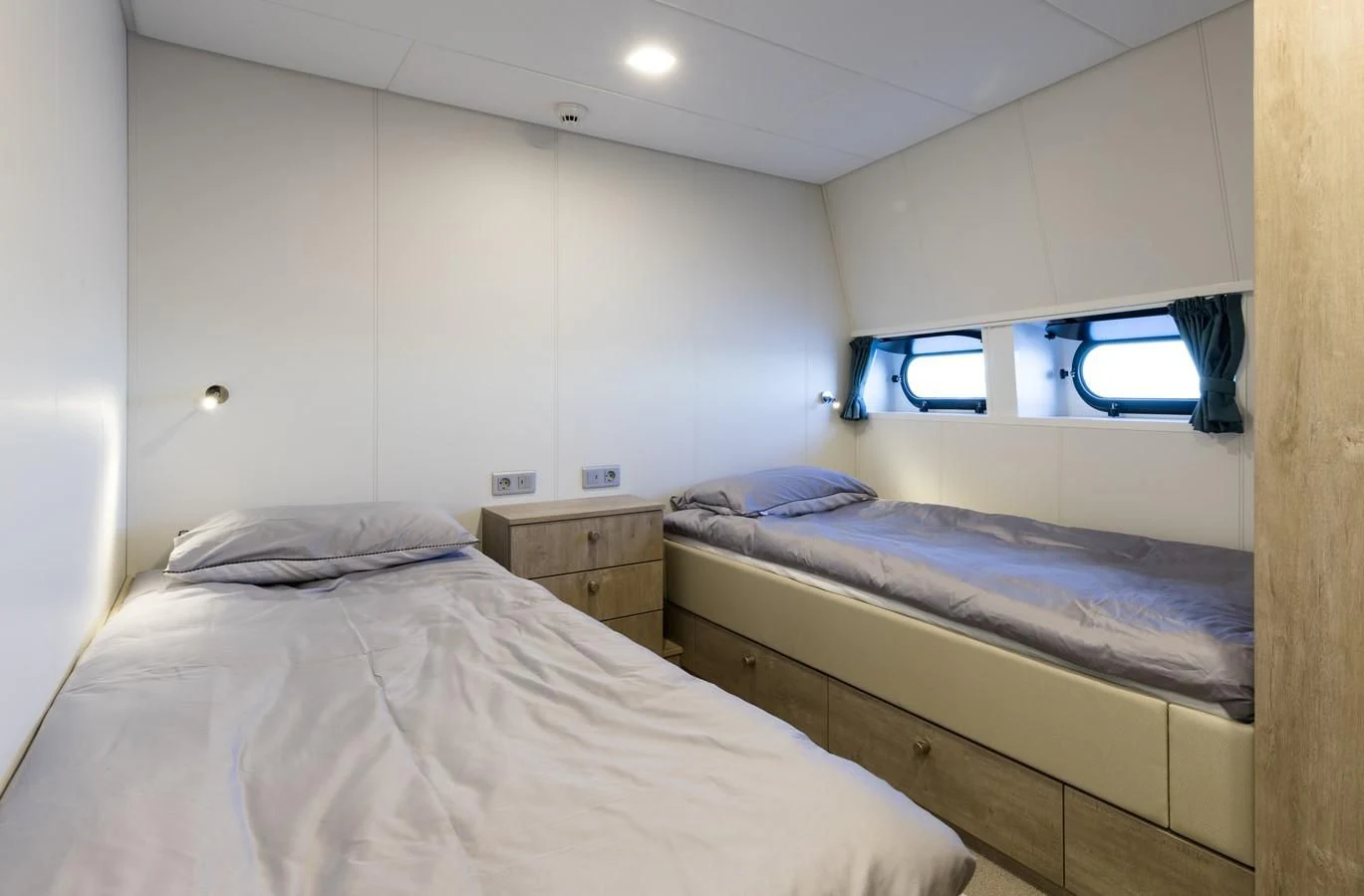 a couple of beds in a room aboard CHASING ROMANCE Yacht for Sale