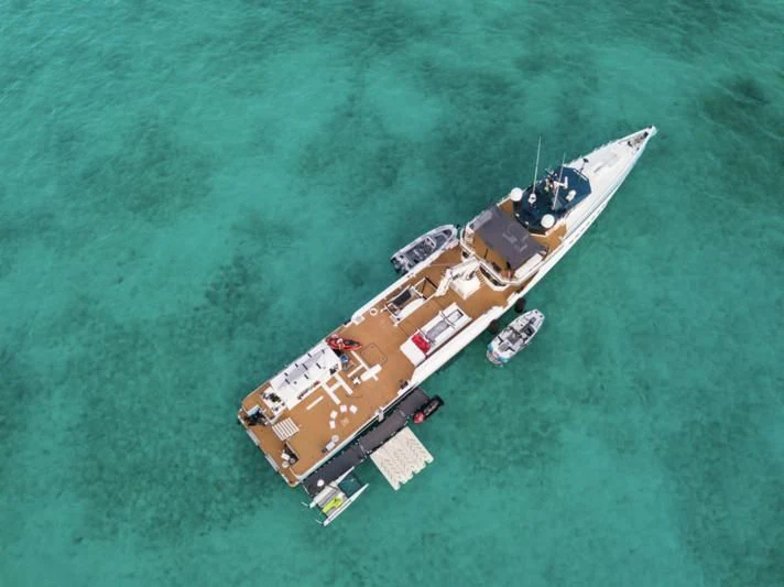 a military ship in the ocean aboard CHASING ROMANCE Yacht for Sale