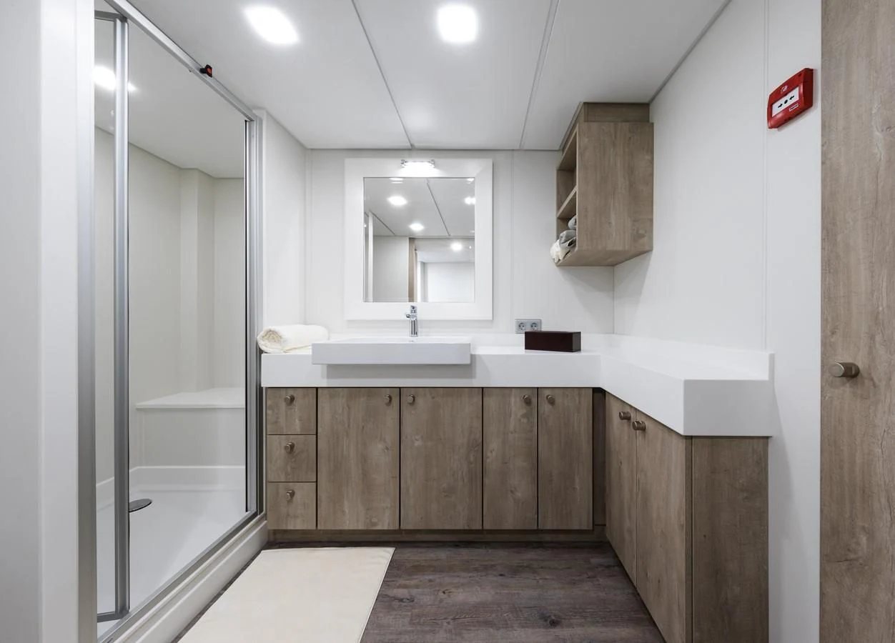 a bathroom with a sink and cabinets aboard CHASING ROMANCE Yacht for Sale