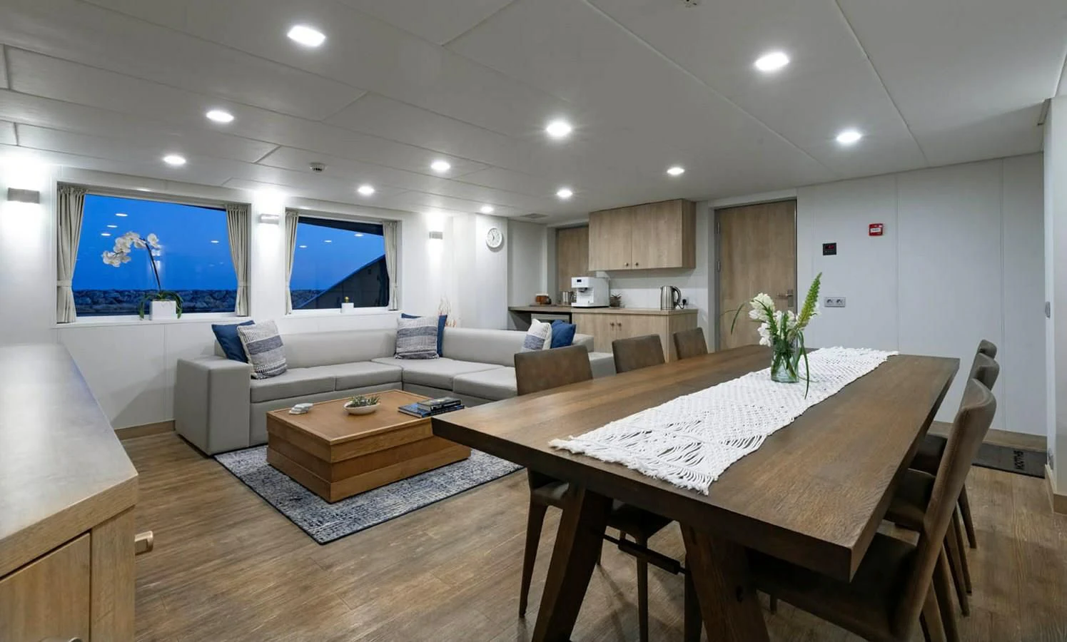 a living room with a large screen aboard CHASING ROMANCE Yacht for Sale