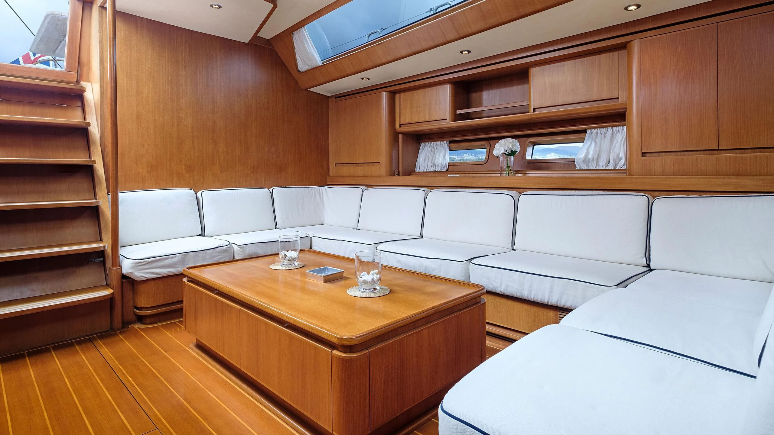 a room with a couch and a table aboard NINA I Yacht for Sale