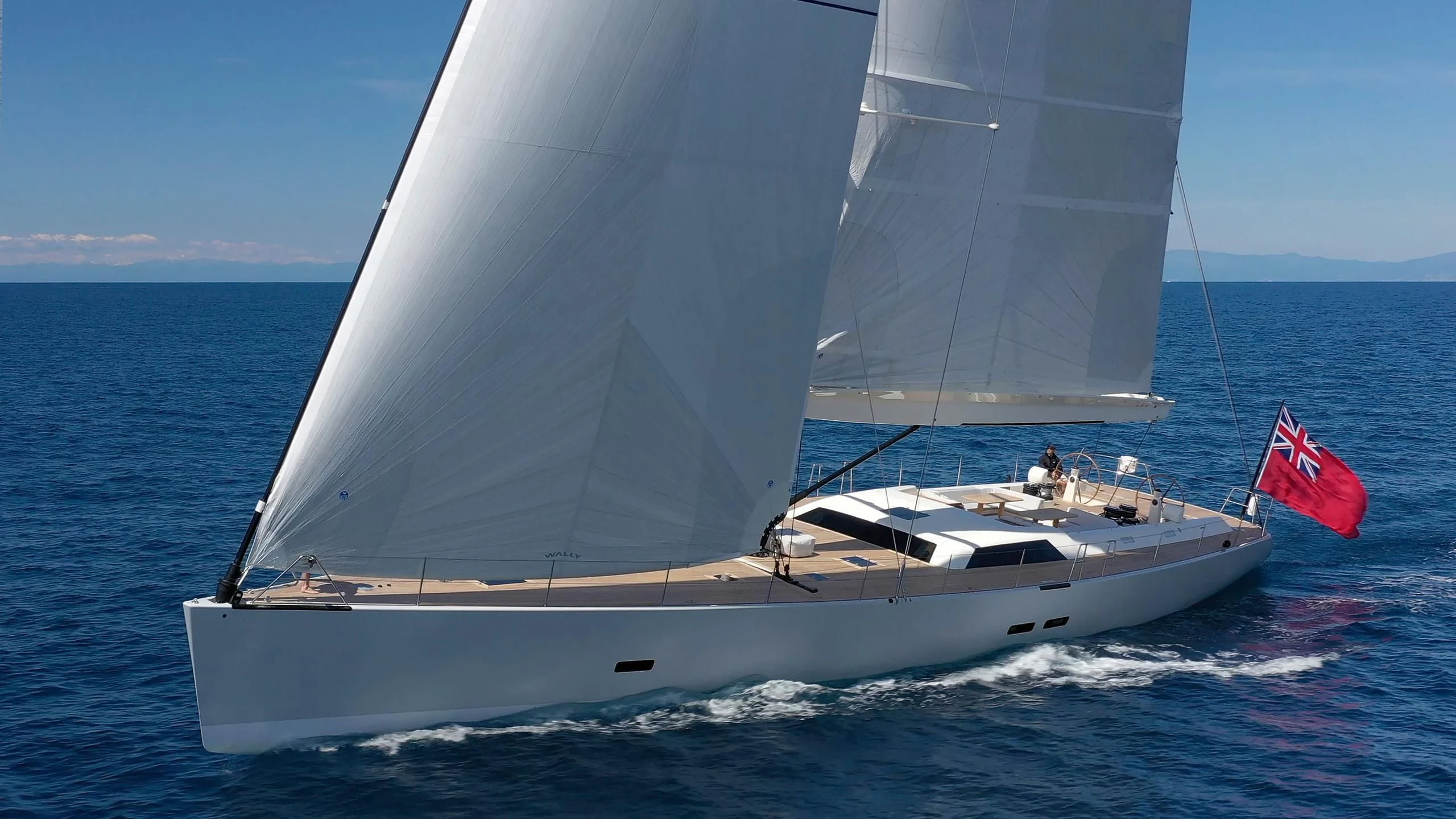 a white boat on the water aboard NINA I Yacht for Sale