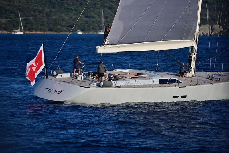 a couple of people on a sailboat in the water aboard NINA I Yacht for Sale
