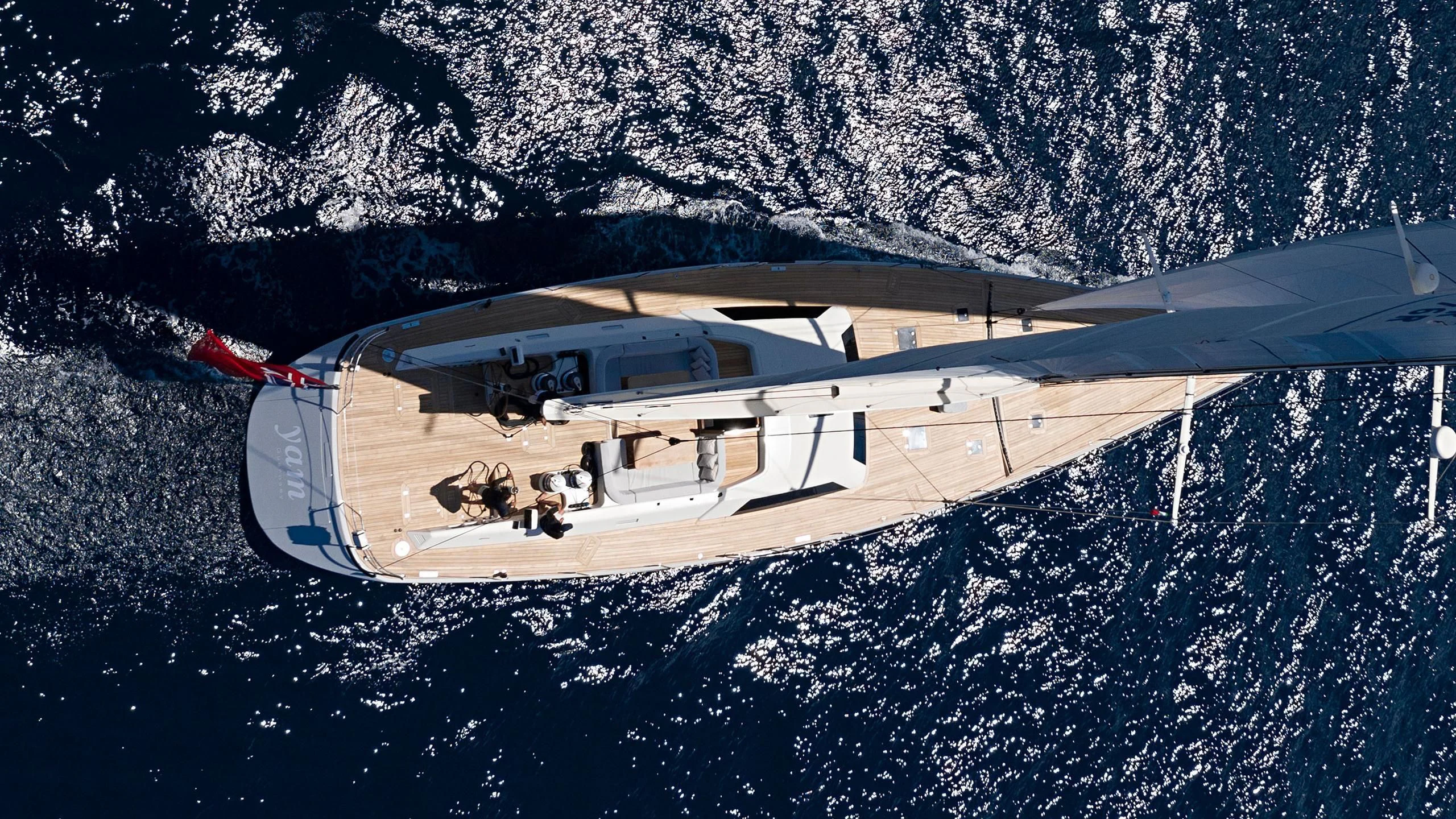 a helicopter flying over a snowy mountain aboard NINA I Yacht for Sale