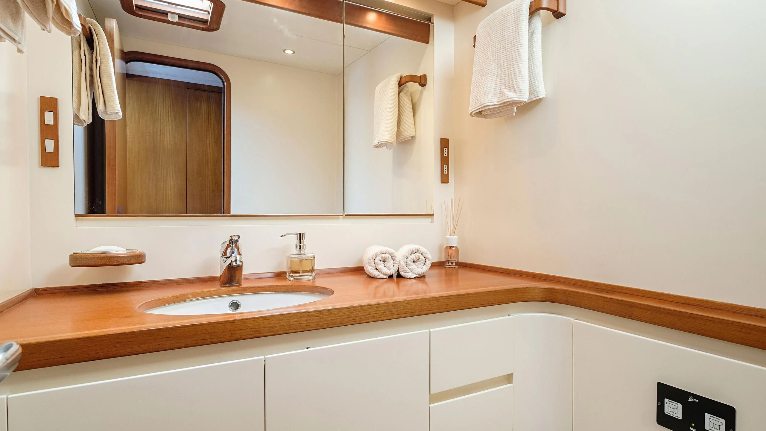 a bathroom with a large mirror aboard NINA I Yacht for Sale