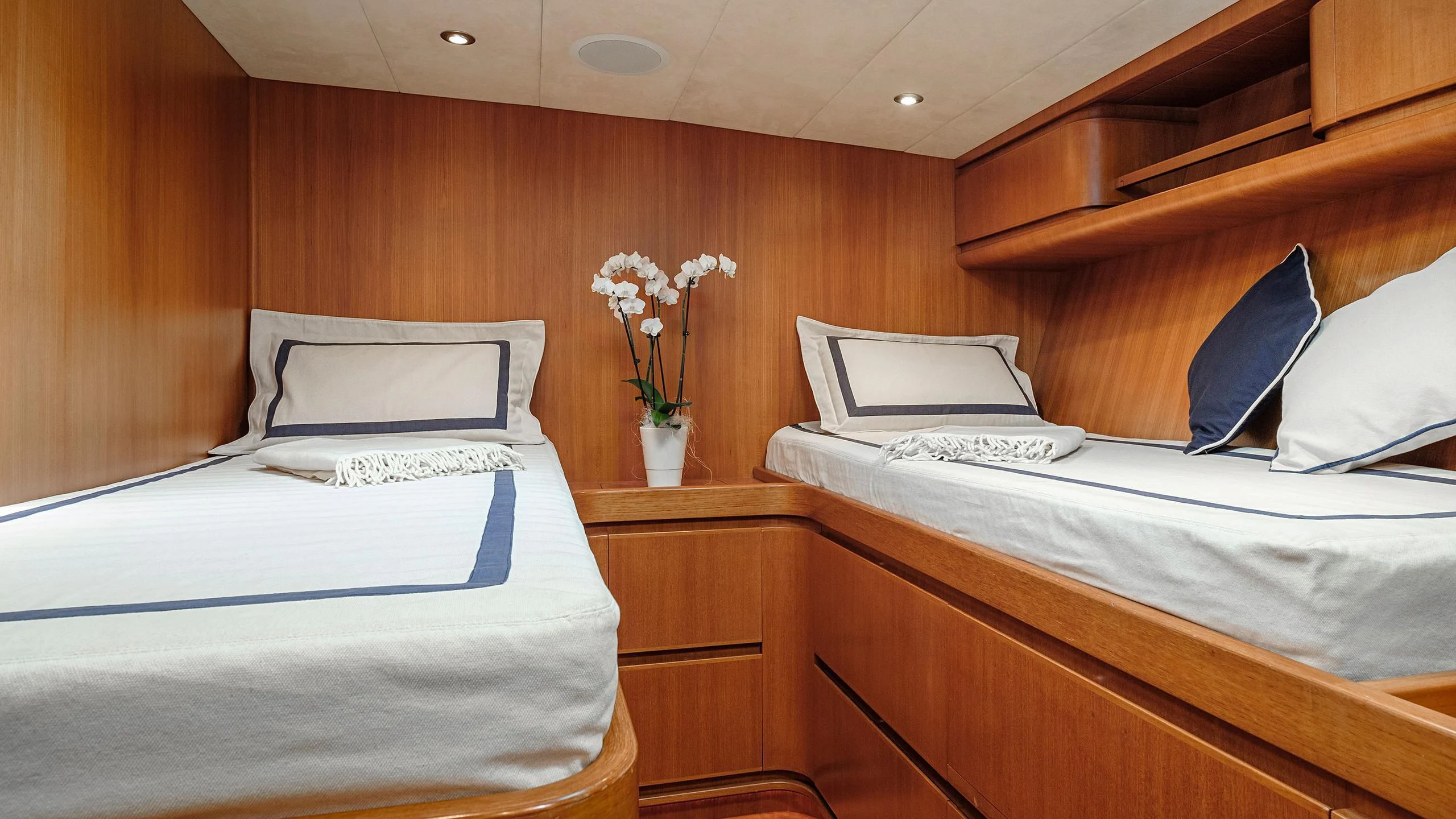 a room with a bed and a flower vase aboard NINA I Yacht for Sale