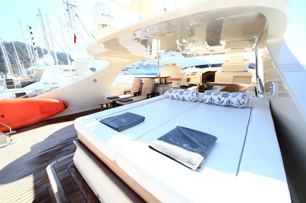 a boat with a blue cover aboard COSMOS LUNA Yacht for Sale