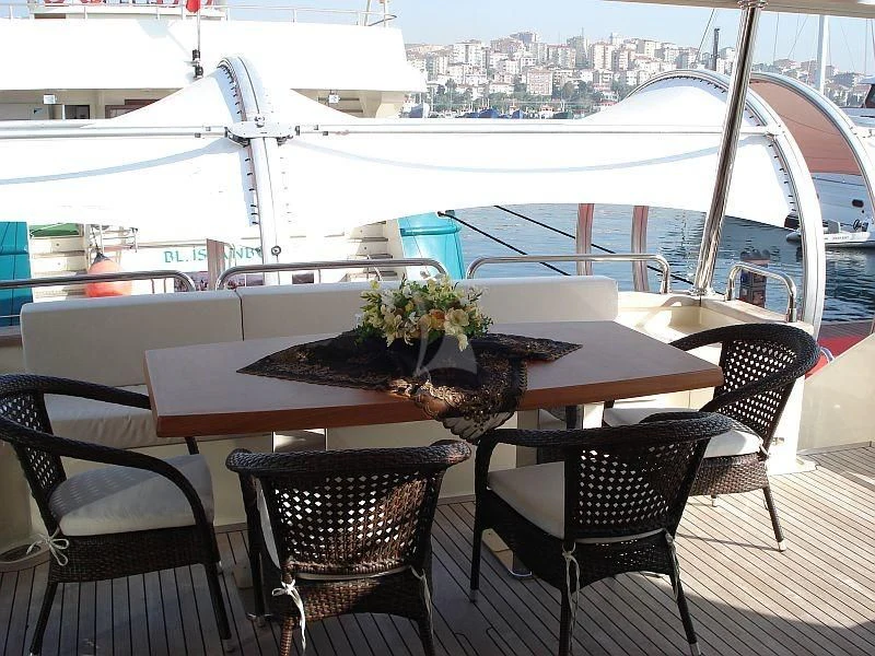 a table with plants on it aboard COSMOS LUNA Yacht for Sale