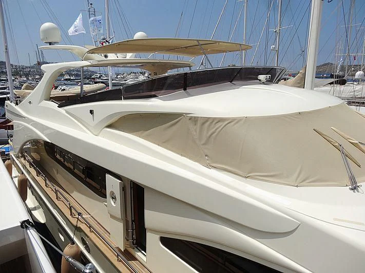 a white boat with a large sail aboard COSMOS LUNA Yacht for Sale