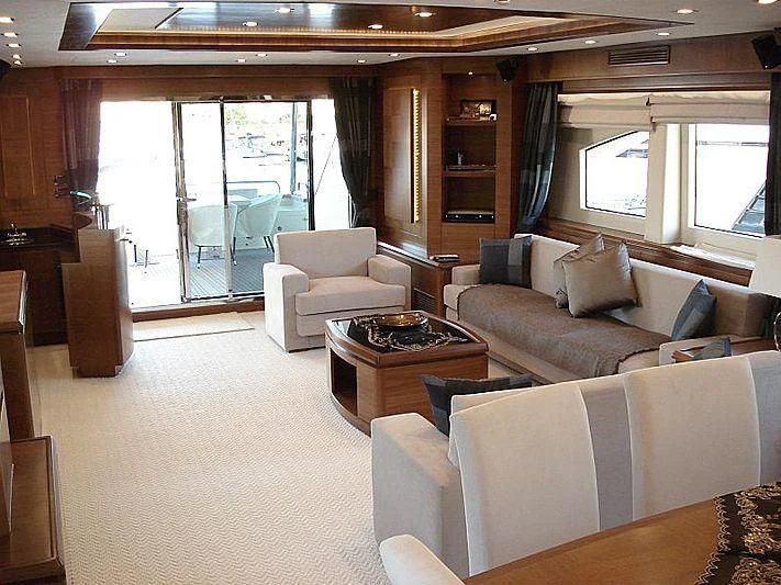 a living room with a couch and a coffee table aboard COSMOS LUNA Yacht for Sale