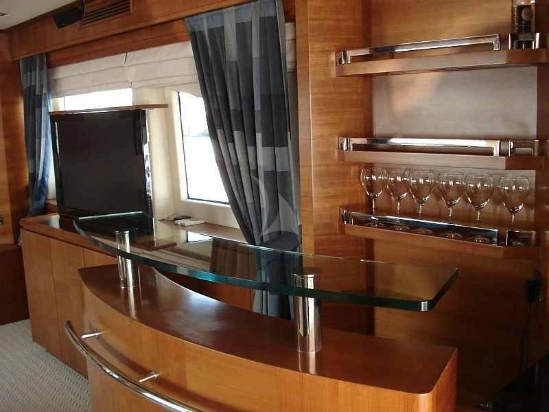 a wine rack with wine glasses aboard COSMOS LUNA Yacht for Sale
