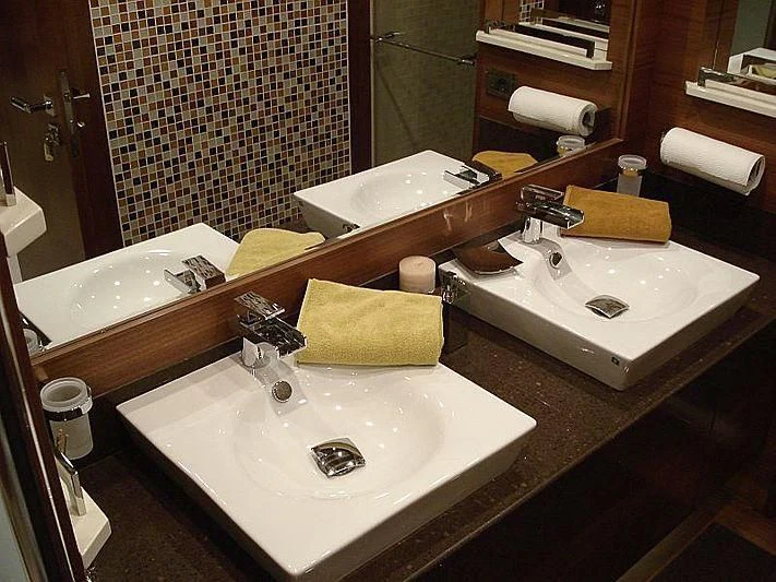 a bathroom with two sinks aboard COSMOS LUNA Yacht for Sale