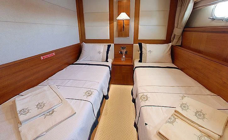 a room with two beds aboard COSMOS LUNA Yacht for Sale