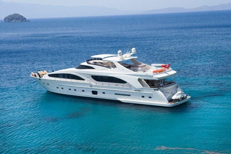 a white yacht in the water aboard COSMOS LUNA Yacht for Sale