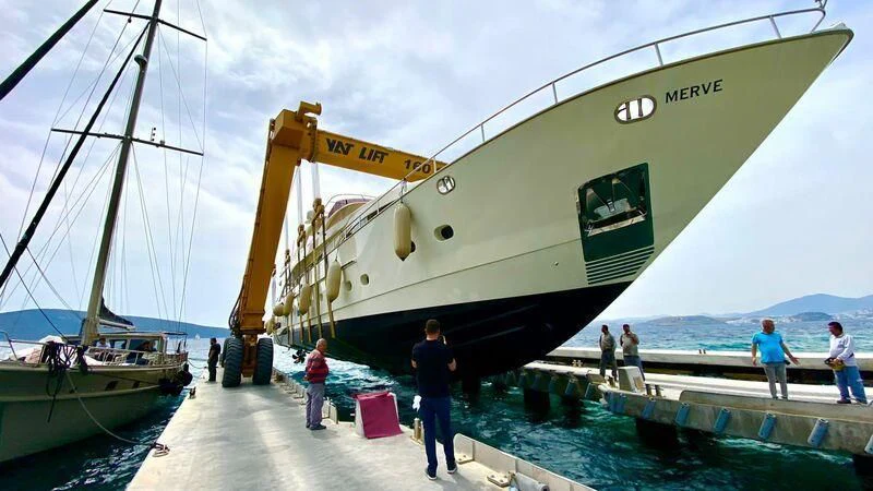 a large crane on a dock aboard COSMOS LUNA Yacht for Sale