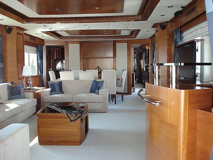 a living room with a couch and a table aboard COSMOS LUNA Yacht for Sale
