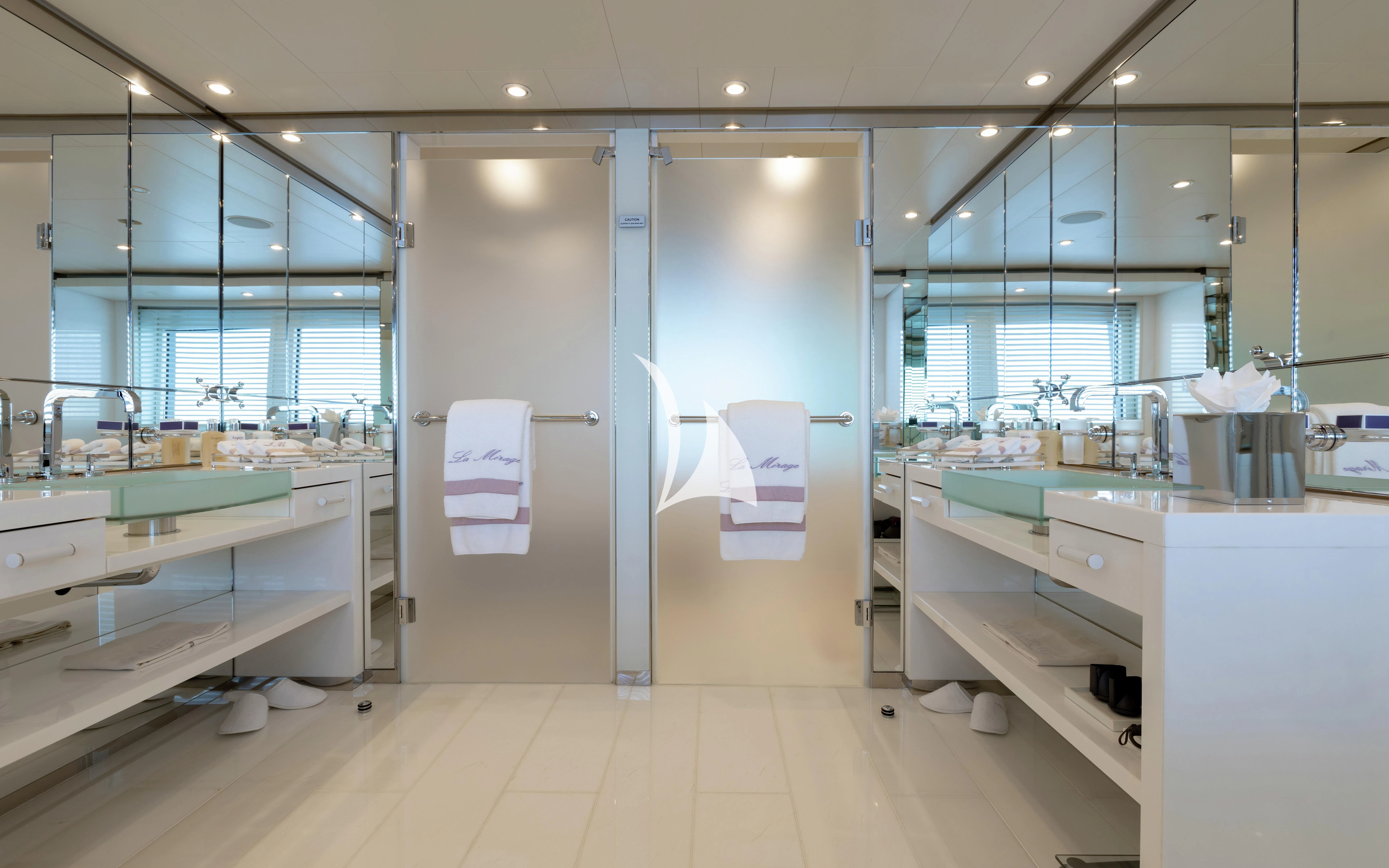 a bathroom with a large mirror aboard LA MIRAGE Yacht for Sale